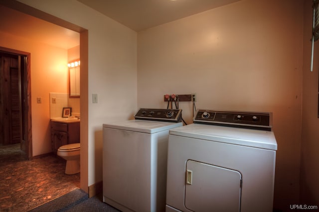 laundry area featuring washing machine and dryer and tile patterned flooring