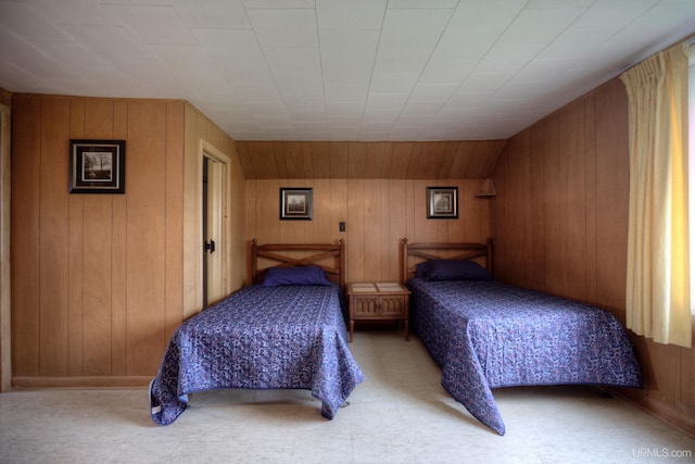 bedroom with wooden walls