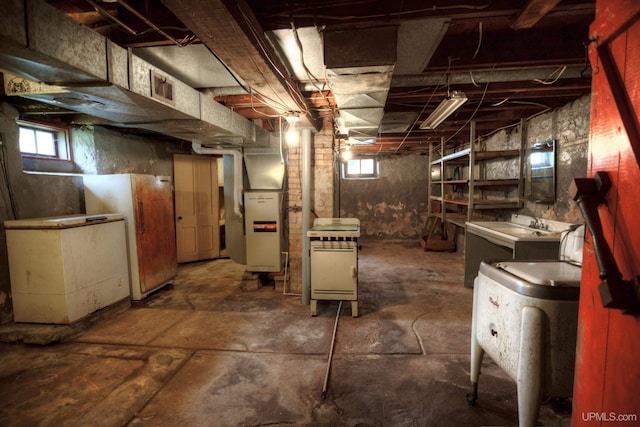 basement with heating unit and a healthy amount of sunlight