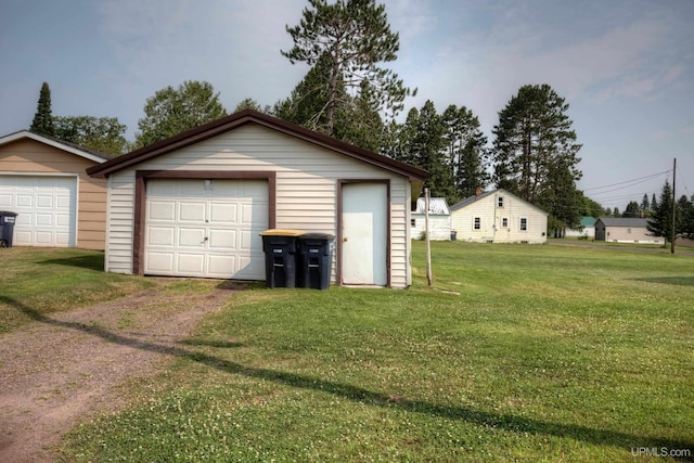 garage featuring a lawn