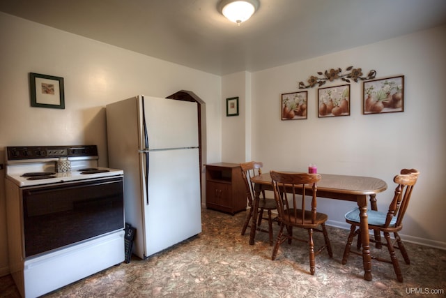 interior space featuring white appliances and light tile patterned floors