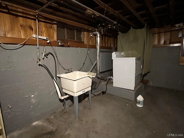 basement featuring washer / clothes dryer and sink