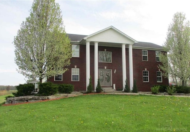 greek revival house with a front yard