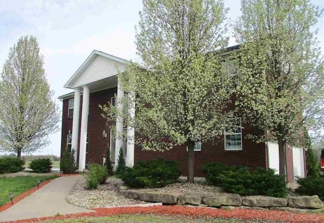 view of side of property with brick siding