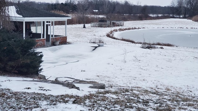 view of yard layered in snow