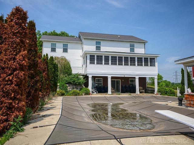 back of house with a patio area