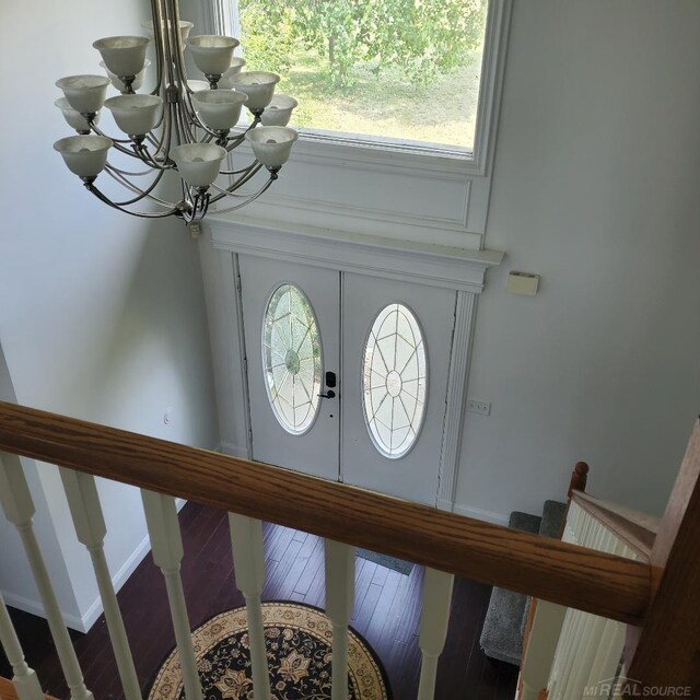 spare room with ceiling fan, a wealth of natural light, and dark hardwood / wood-style floors