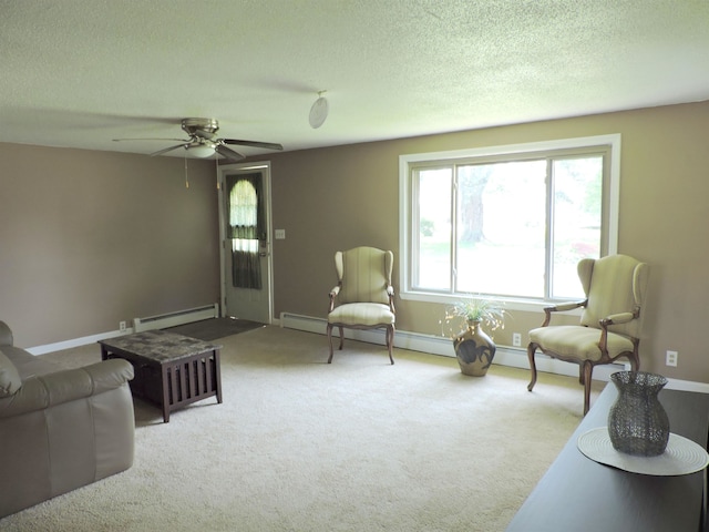 carpeted living room with a baseboard radiator, a textured ceiling, and ceiling fan