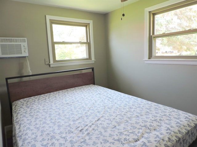 bedroom with a wall mounted air conditioner