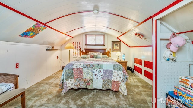 carpeted bedroom with vaulted ceiling