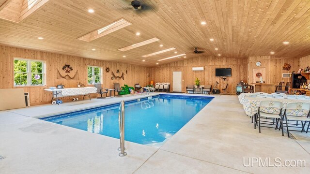 view of swimming pool with a skylight