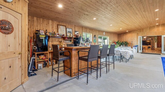 bar with wood walls and wooden ceiling