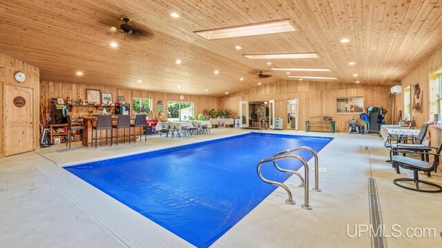 view of pool featuring a skylight