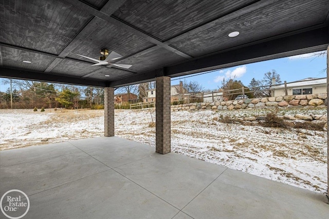 snow covered patio with ceiling fan