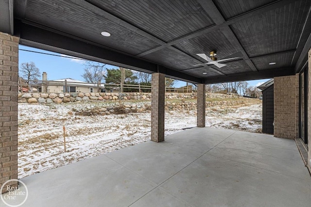 snow covered patio with ceiling fan