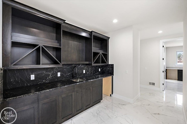 bar featuring baseboards, visible vents, marble finish floor, a sink, and recessed lighting