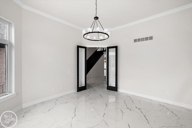 empty room featuring baseboards, visible vents, and ornamental molding