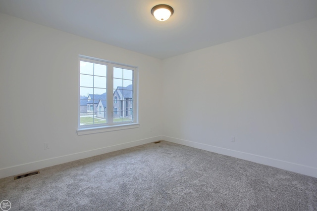 unfurnished room featuring carpet flooring