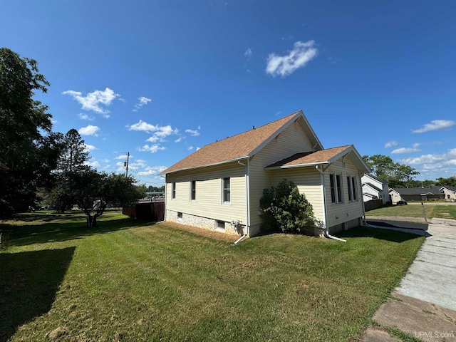 view of property exterior featuring a yard