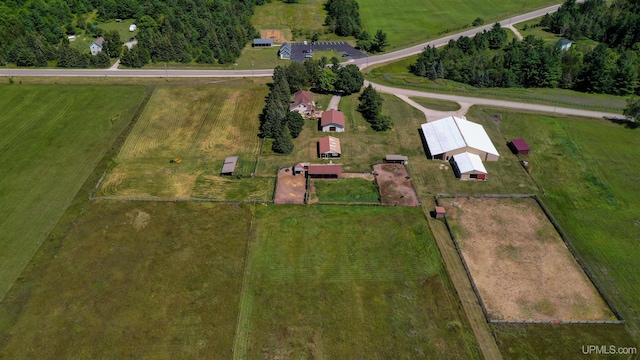 birds eye view of property with a rural view