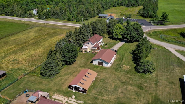 birds eye view of property featuring a rural view