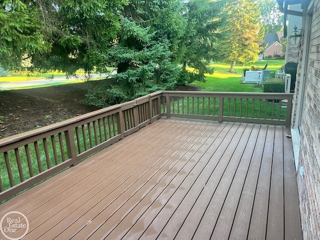 wooden deck with a yard