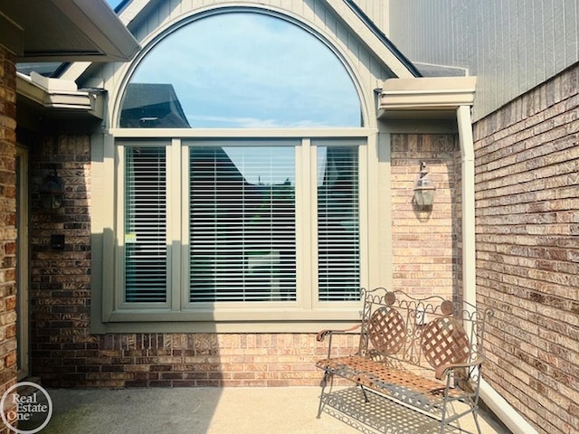 entrance to property with a patio