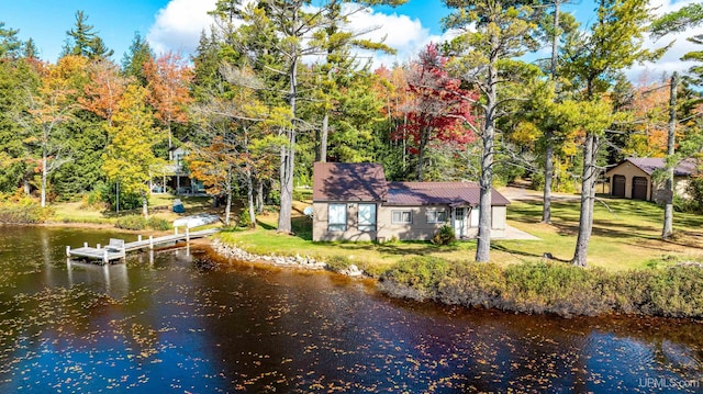 exterior space featuring a water view and a yard