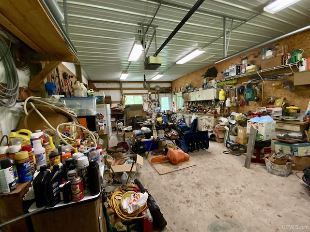 interior space with a workshop area, concrete flooring, and a garage
