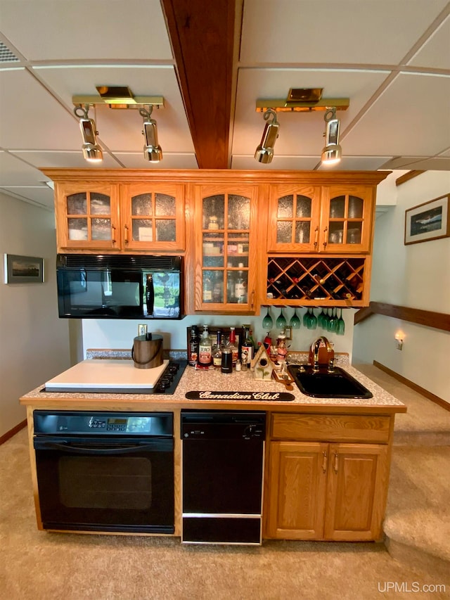 kitchen with light carpet, a paneled ceiling, sink, and black appliances