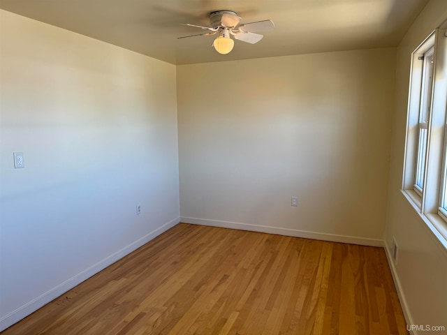 spare room with ceiling fan and hardwood / wood-style floors