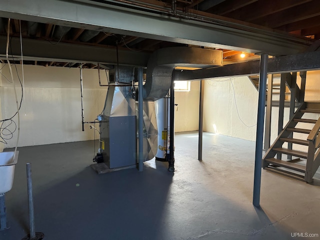 basement with heating unit and water heater