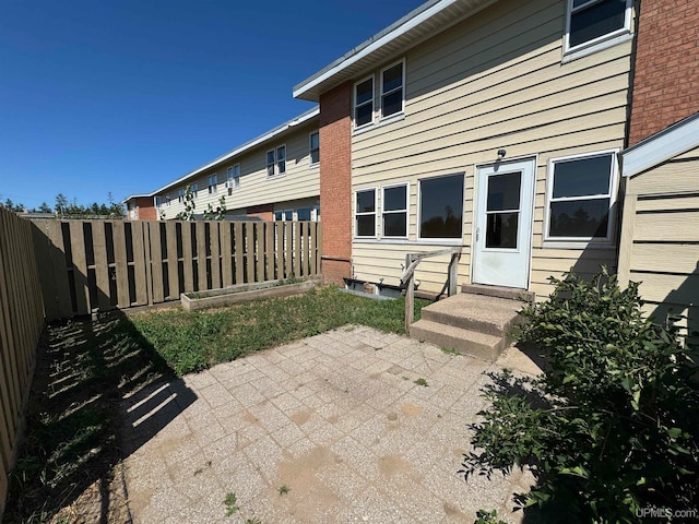 rear view of property featuring a patio area