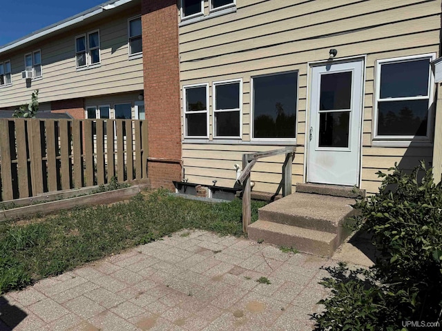 entrance to property featuring a patio