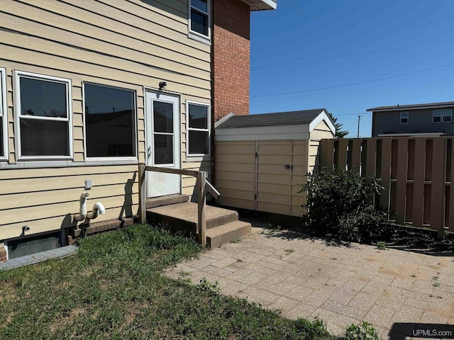 view of home's exterior featuring a storage unit