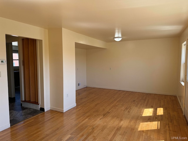 unfurnished room featuring wood-type flooring