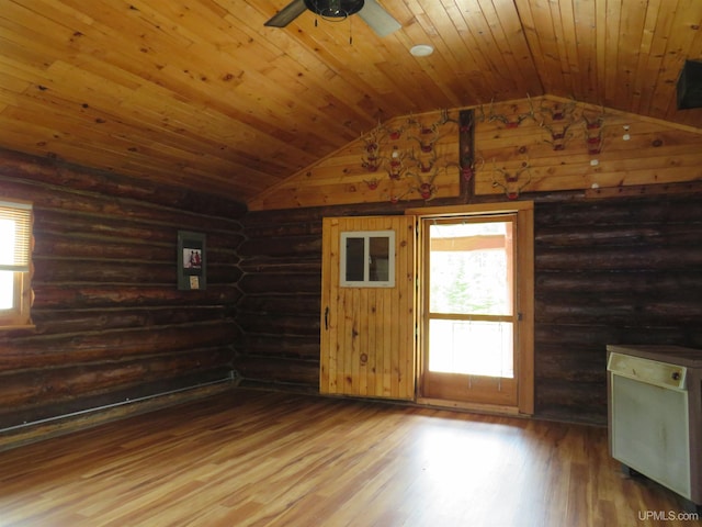 interior space featuring rustic walls, ceiling fan, wood ceiling, and wood-type flooring