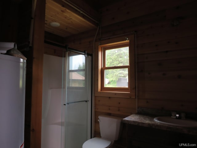 bathroom with wood ceiling, wooden walls, toilet, and vanity