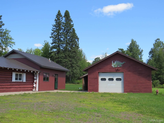 garage with a yard