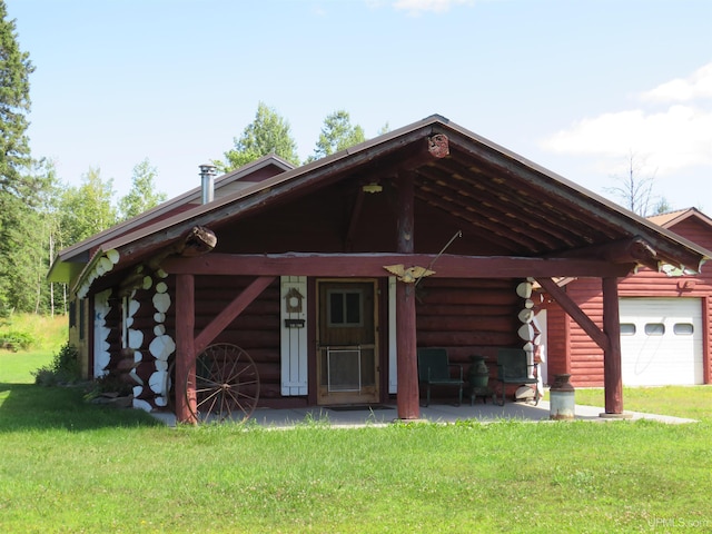 exterior space with a front lawn and a garage