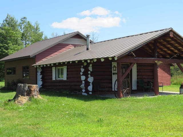 rear view of house with a lawn