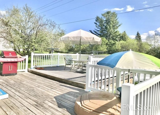 wooden deck featuring grilling area