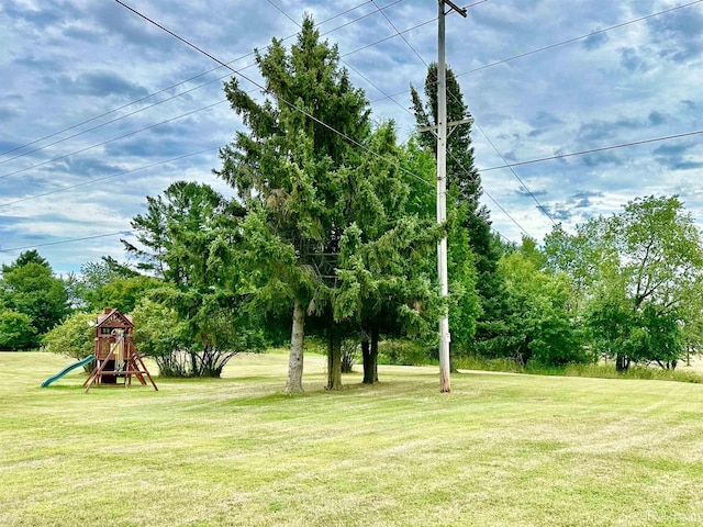 W5423 Curry Ln, Norway, MI 49870 - view of grassy yard with a playground