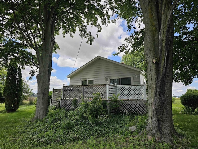 view of side of home featuring a deck