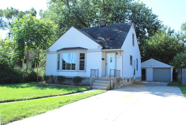 view of front facade featuring a garage, an outdoor structure, and a front lawn