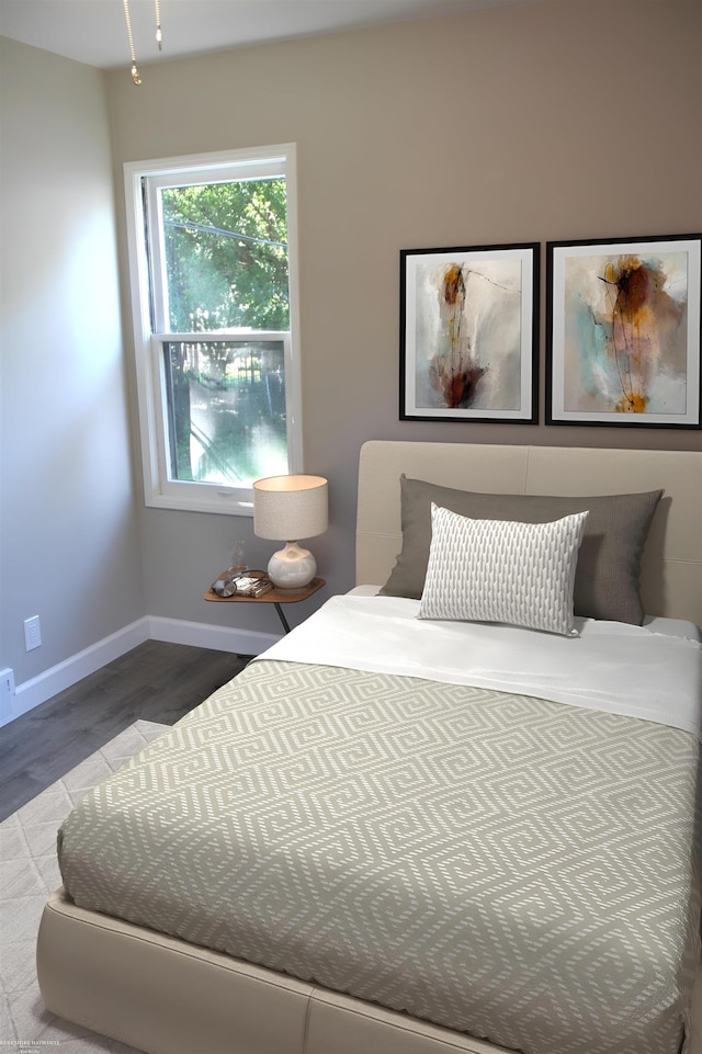 bedroom featuring wood-type flooring