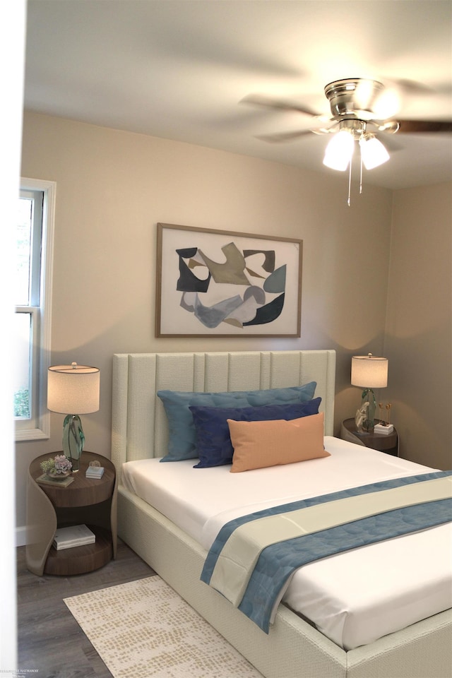 bedroom featuring ceiling fan and dark wood-type flooring