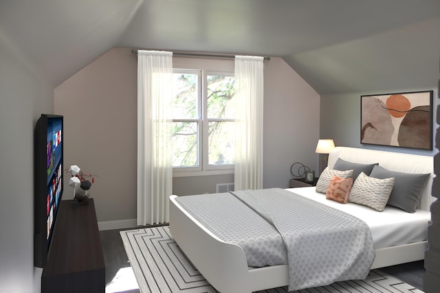 bedroom with vaulted ceiling and hardwood / wood-style floors