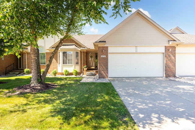 view of front facade with a garage and a front lawn