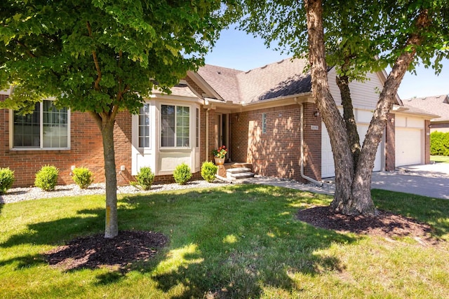 view of front of home with a garage and a front lawn